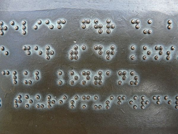 Don't assume anything. May of today's web users are blind and reading a screen is not as easy as reading braille.  